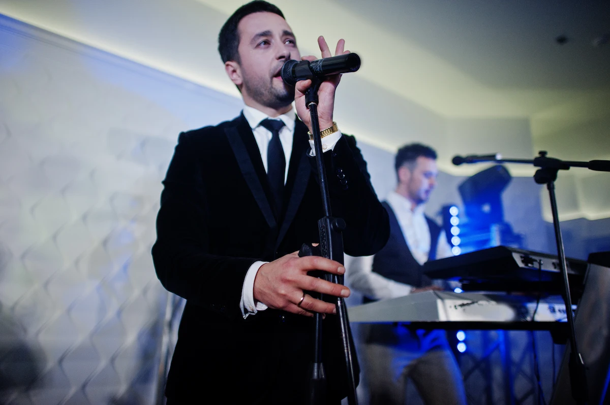 man-singing-with-band-playing-keyboard
