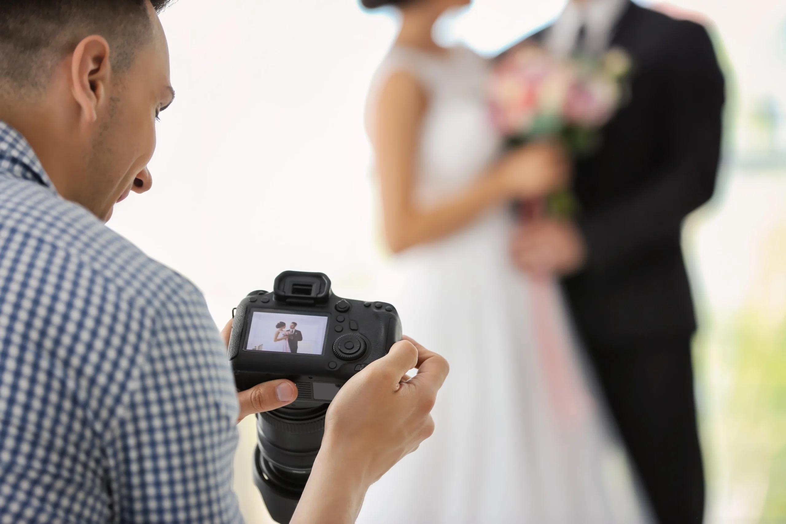 professional-photographer-with-camera-and-wedding